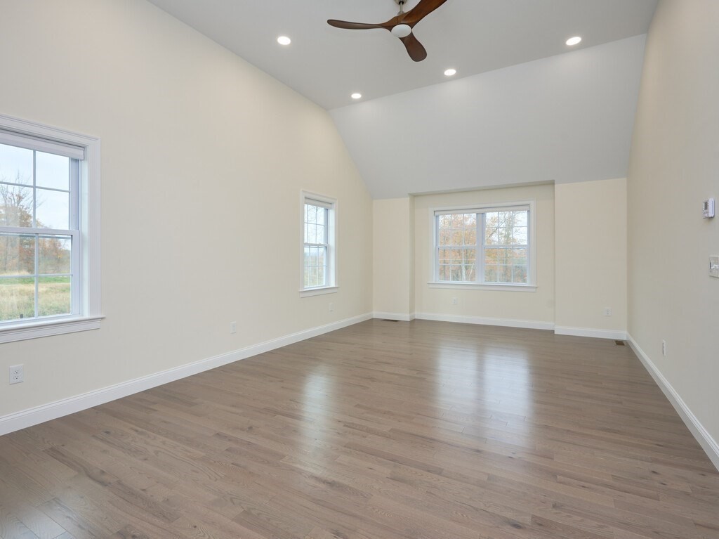 795 Leominster Road Lunenburg, MA 01462 - Photo 11 of 33 an empty room with wooden floor and windows