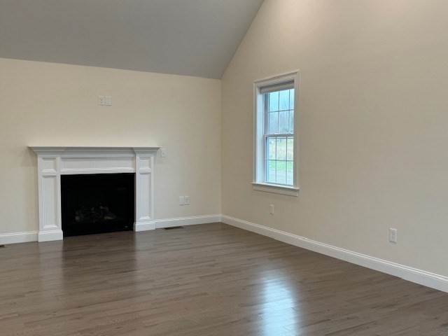 795 Leominster Road Lunenburg, MA 01462 - Photo 15 of 33 a view of an empty room with wooden floor and a fireplace