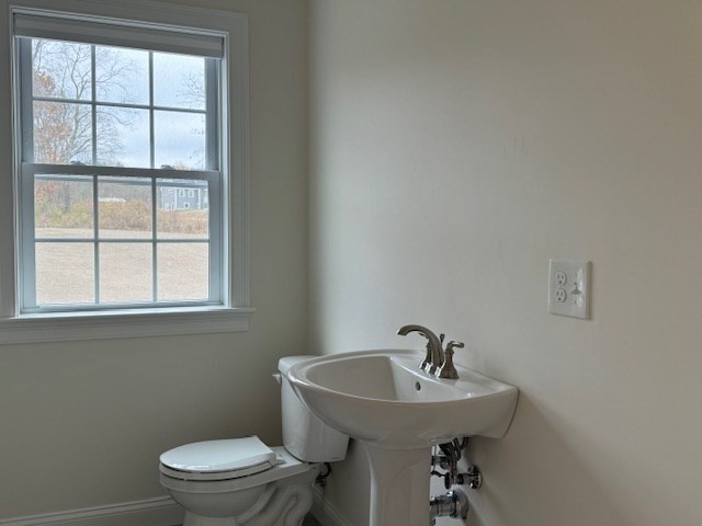 795 Leominster Road Lunenburg, MA 01462 - Photo 33 of 33 a bathroom with a sink a mirror and a toilet