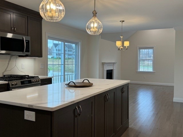 795 Leominster Road Lunenburg, MA 01462 - Photo 9 of 33 a kitchen with stainless steel appliances granite countertop a sink a stove and a microwave