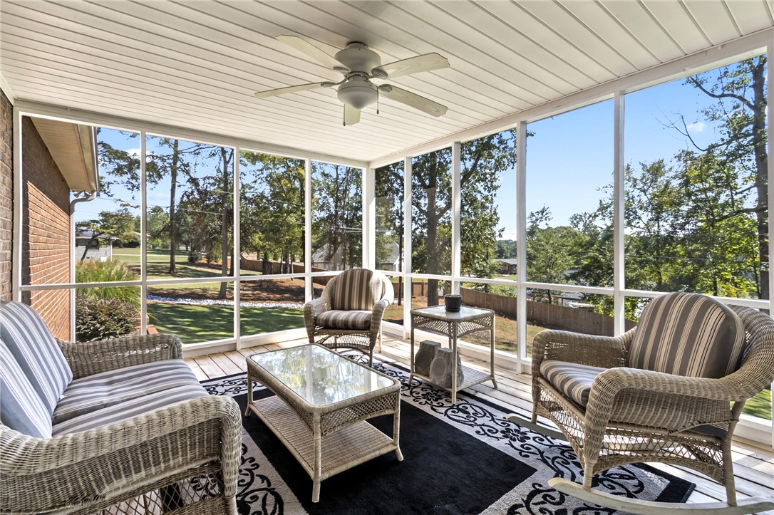 608 Robin Hood Lane Anderson, SC 29621 - Photo 25 of 36 Floor-to-ceiling screens frame tranquil wooded views from this spacious backyard porch.