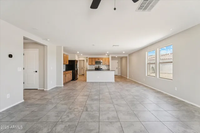 a view of a big room with closet and windows