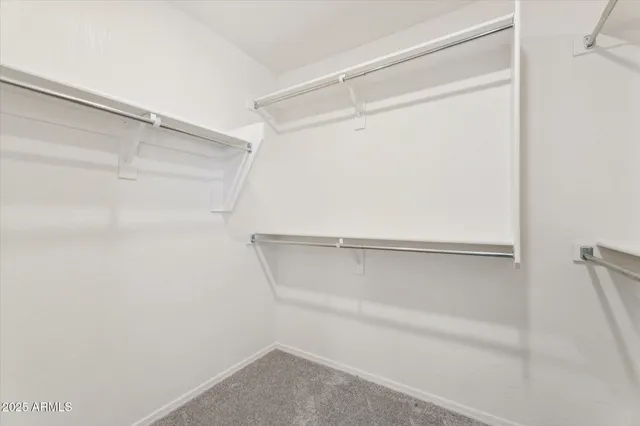 a view of an empty walk in closet