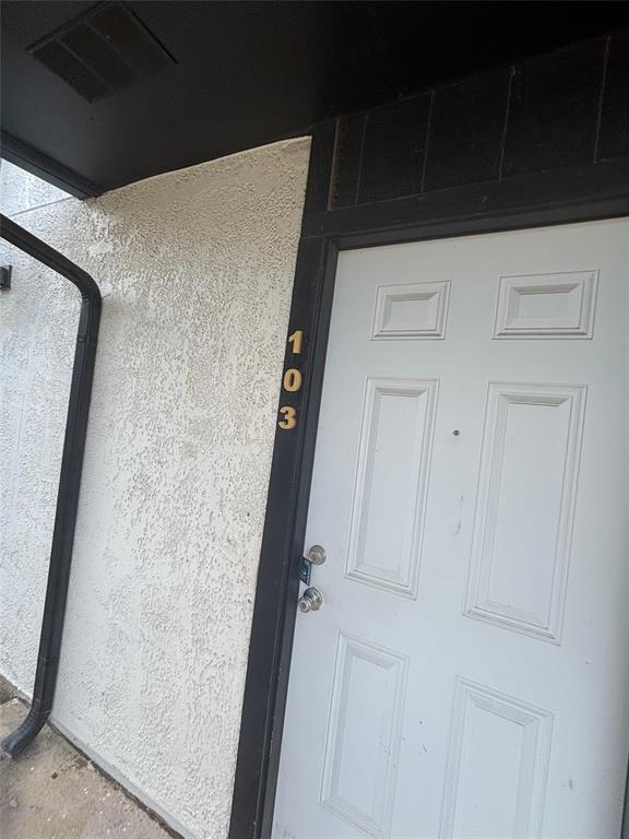 301 Rolston Road, Unit 317103 Irving, TX 75060 - Photo 1 of 9 White paneled entry door with polished chrome hardware, framed by black trim