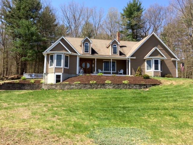15 Jordan Road Windham, CT 06226 - Photo 1 of 1 a front view of a house with a yard table and chairs