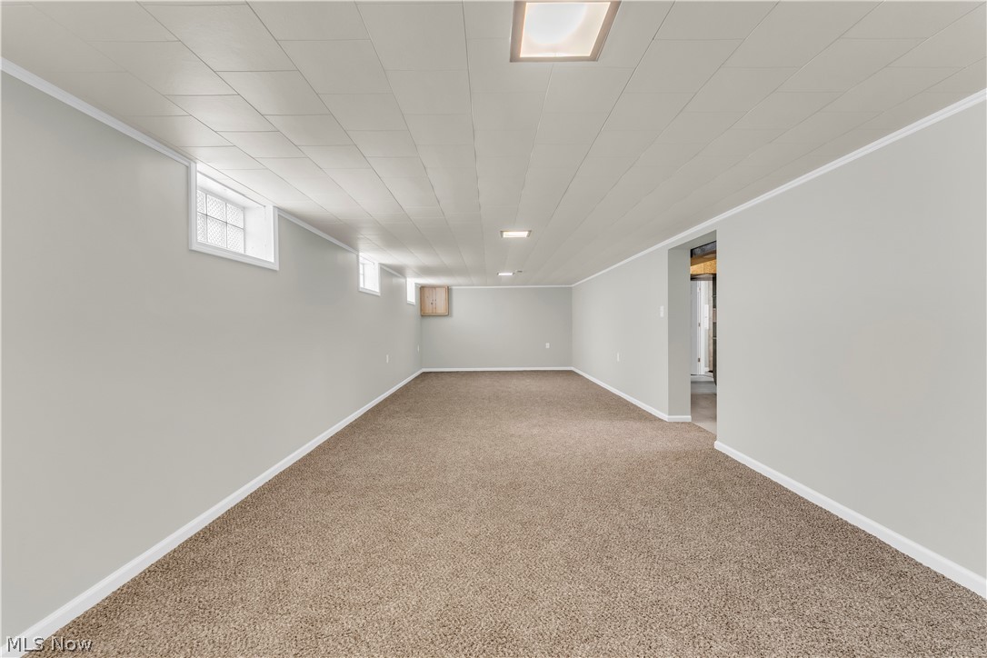 3023 Norris Avenue Cleveland, OH 44134 - Photo 28 of 41 Spacious room featuring light gray walls, brown carpeting, and white trim
