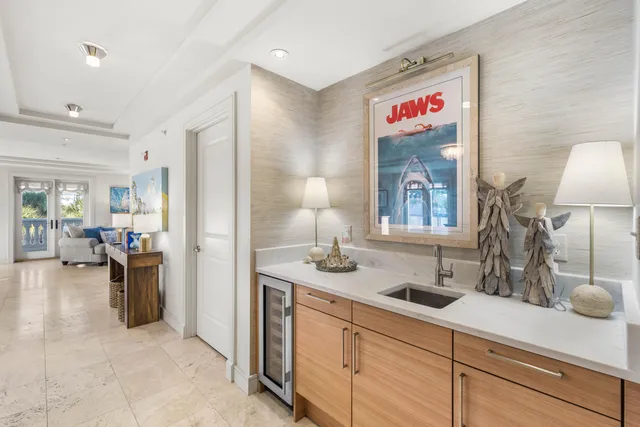 a bedroom with a bed and a flat tv screen on dresser