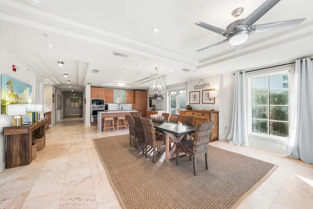 a bedroom with a large bed a flat tv screen and balcony
