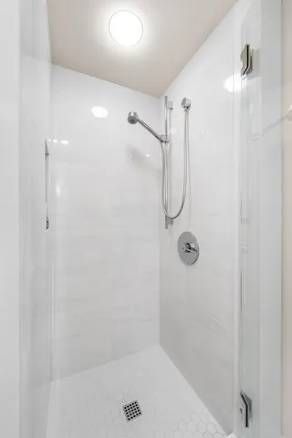 a view of a swimming pool with a lounge chair