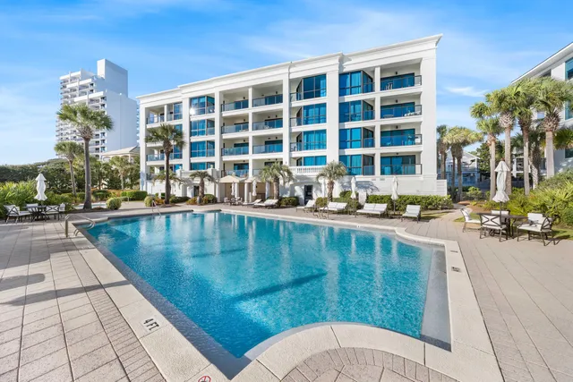 a view of a swimming pool with a patio