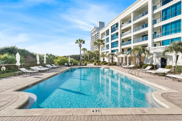 a view of a chairs and table in the patio
