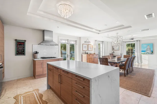 a kitchen with a stove a sink and a refrigerator