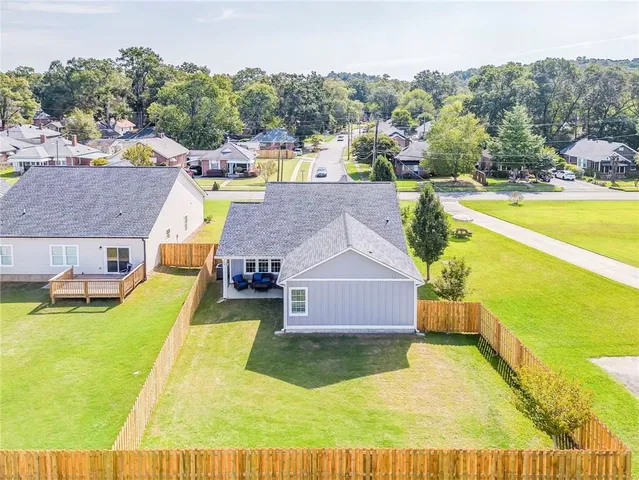 a view of a swimming pool with an outdoor space and seating area