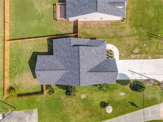 a aerial view of a house with a swimming pool