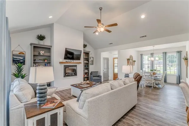 a living room with fireplace furniture and a flat screen tv