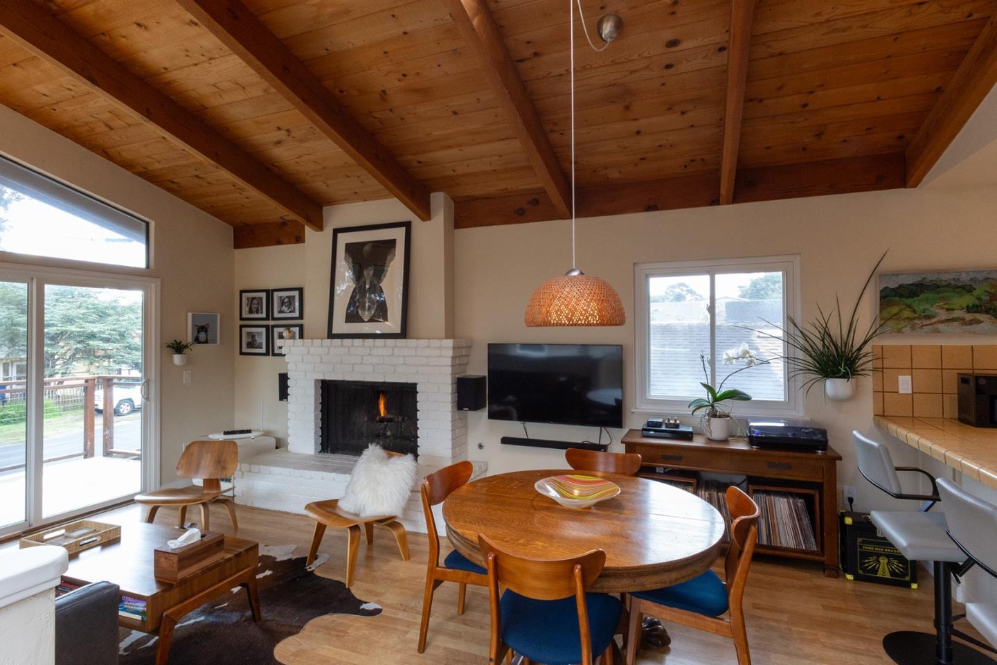 779 Alice Street Monterey, CA 93940 - Photo 8 of 27 a living room with furniture a fireplace and a table