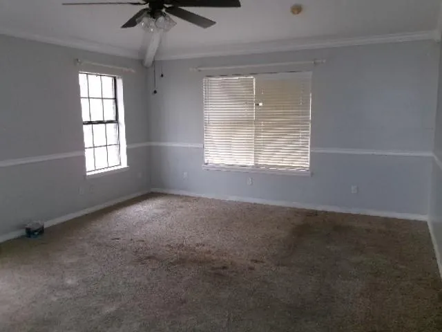 an empty room that has a window