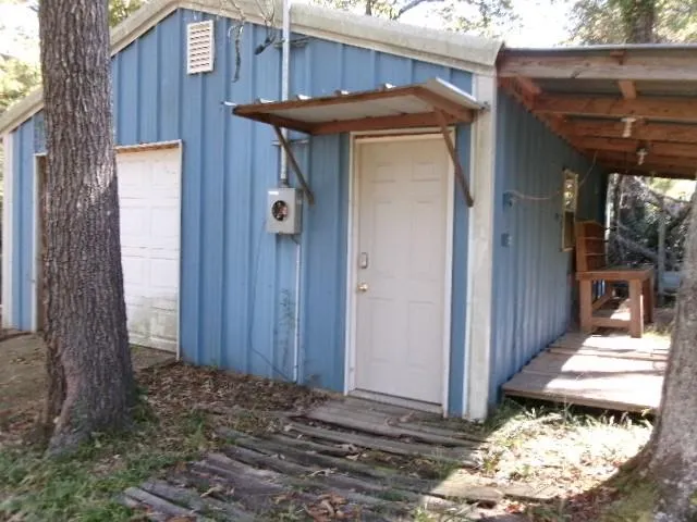 a view of a wooden door of the house