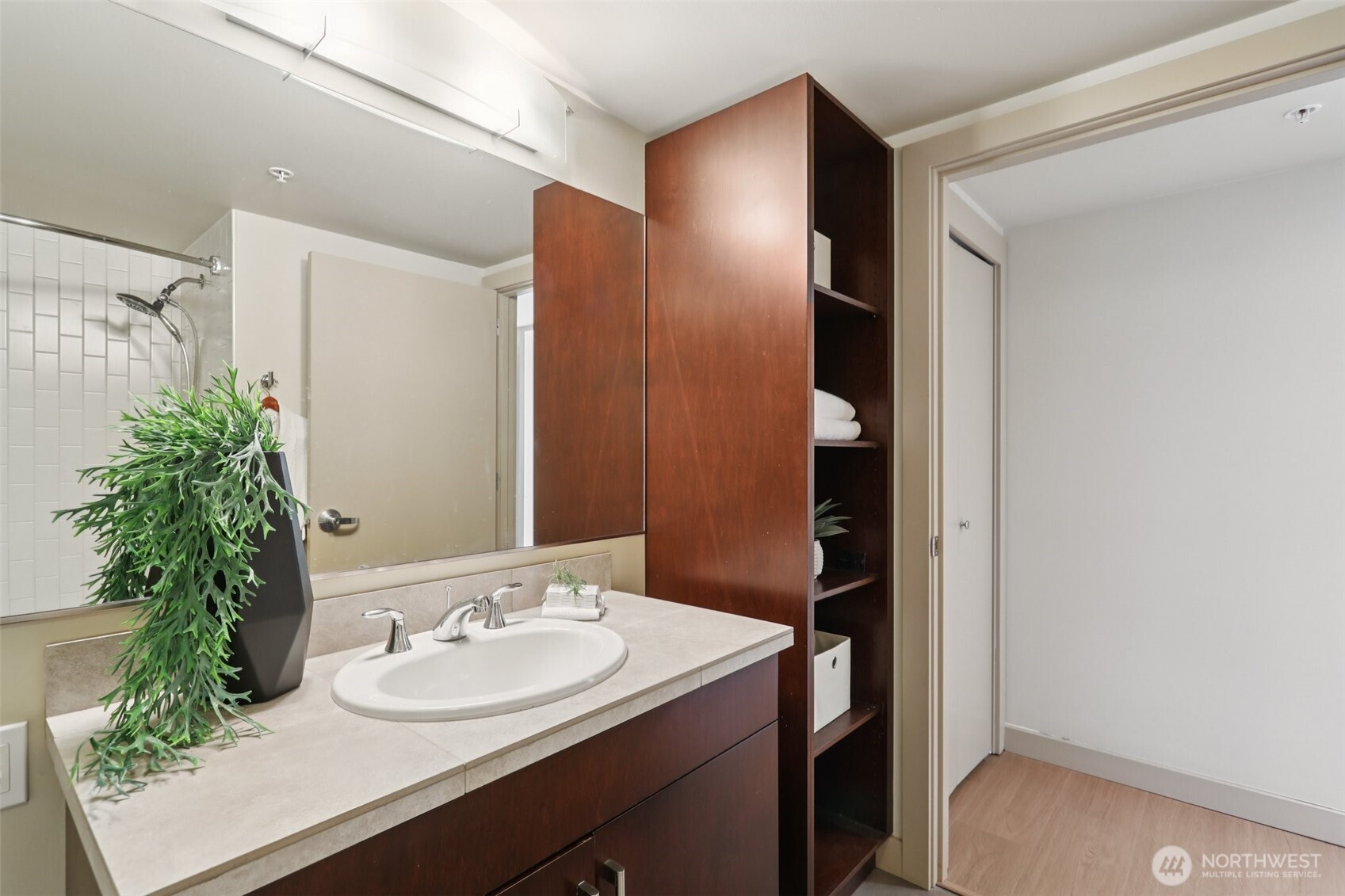 900 Lenora Street, Unit W106 Seattle, WA 98121 - Photo 14 of 40 a bathroom with a sink and a mirror