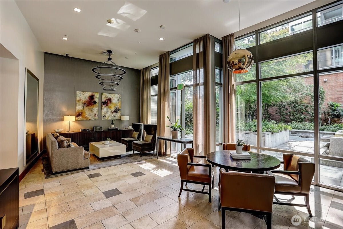 900 Lenora Street, Unit W106 Seattle, WA 98121 - Photo 23 of 40 a living room with furniture and a large window