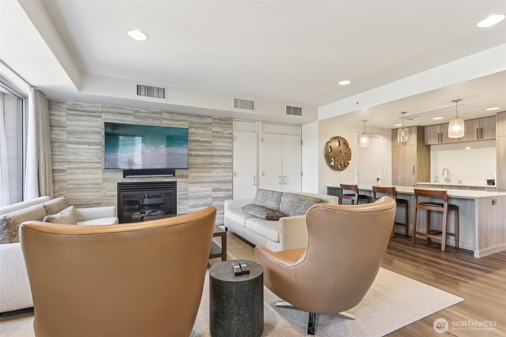 900 Lenora Street, Unit W106 Seattle, WA 98121 - Photo 24 of 40 a living room with furniture a fireplace and a large window
