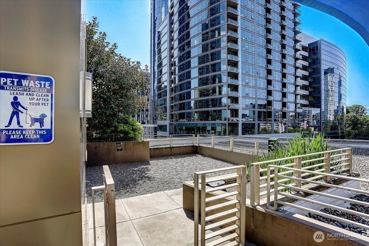 900 Lenora Street, Unit W106 Seattle, WA 98121 - Photo 37 of 40 a view of a swimming pool with a bench