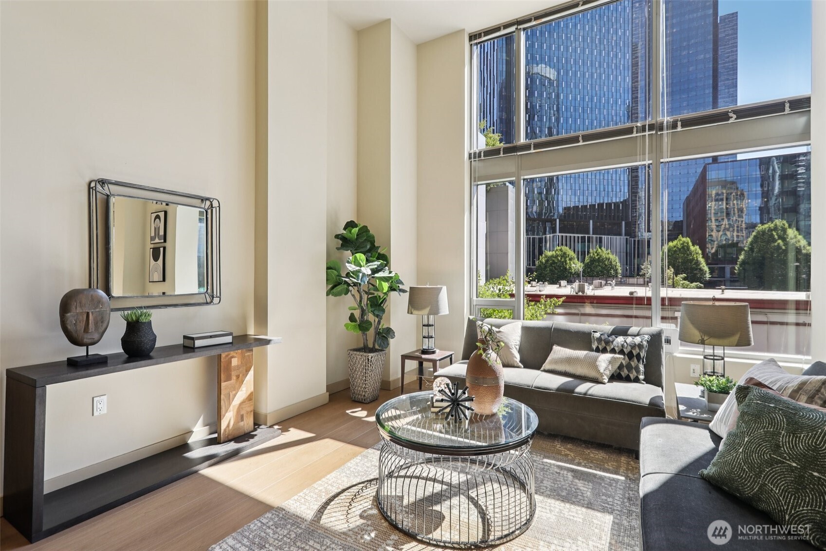 900 Lenora Street, Unit W106 Seattle, WA 98121 - Photo 8 of 40 a living room with furniture and a potted plant