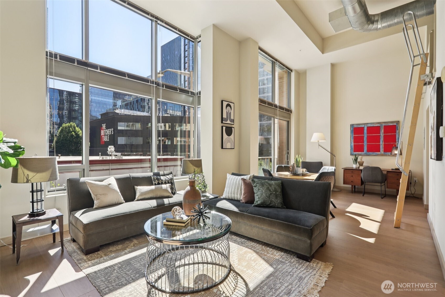 900 Lenora Street, Unit W106 Seattle, WA 98121 - Photo 10 of 40 a living room with furniture and a large window