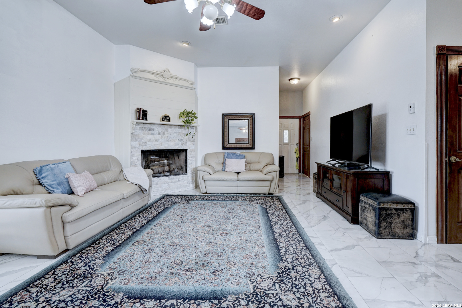 309 South Rolling Oaks Lane San Antonio, TX 78253 - Photo 14 of 43 a living room with furniture and a fireplace