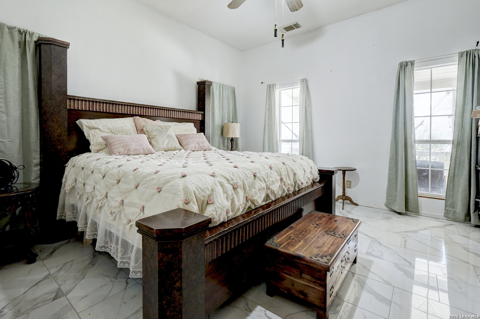 309 South Rolling Oaks Lane San Antonio, TX 78253 - Photo 19 of 43 a bed sitting in a bedroom next to a window