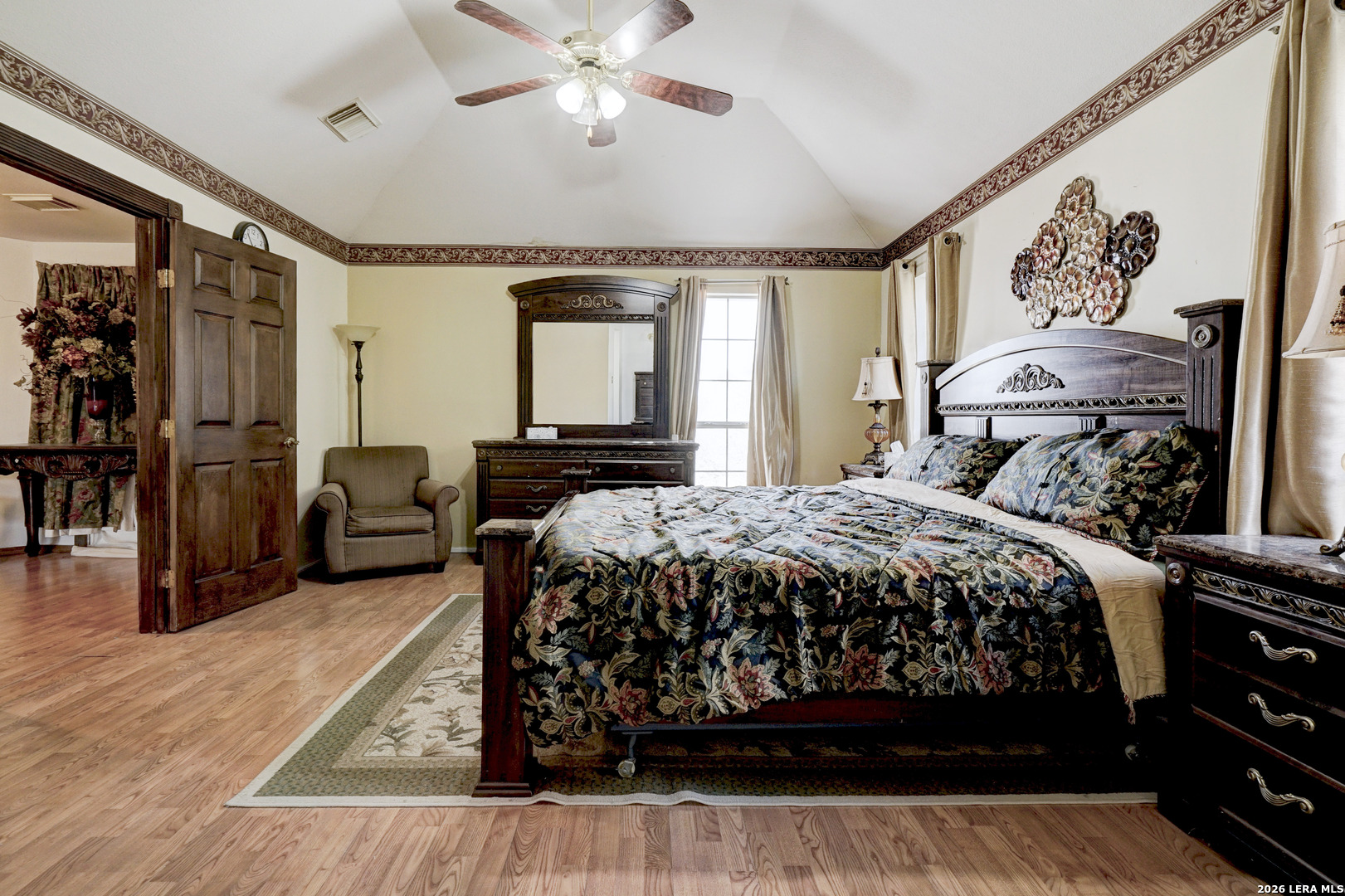309 South Rolling Oaks Lane San Antonio, TX 78253 - Photo 25 of 43 a bedroom with a large bed and a chandelier