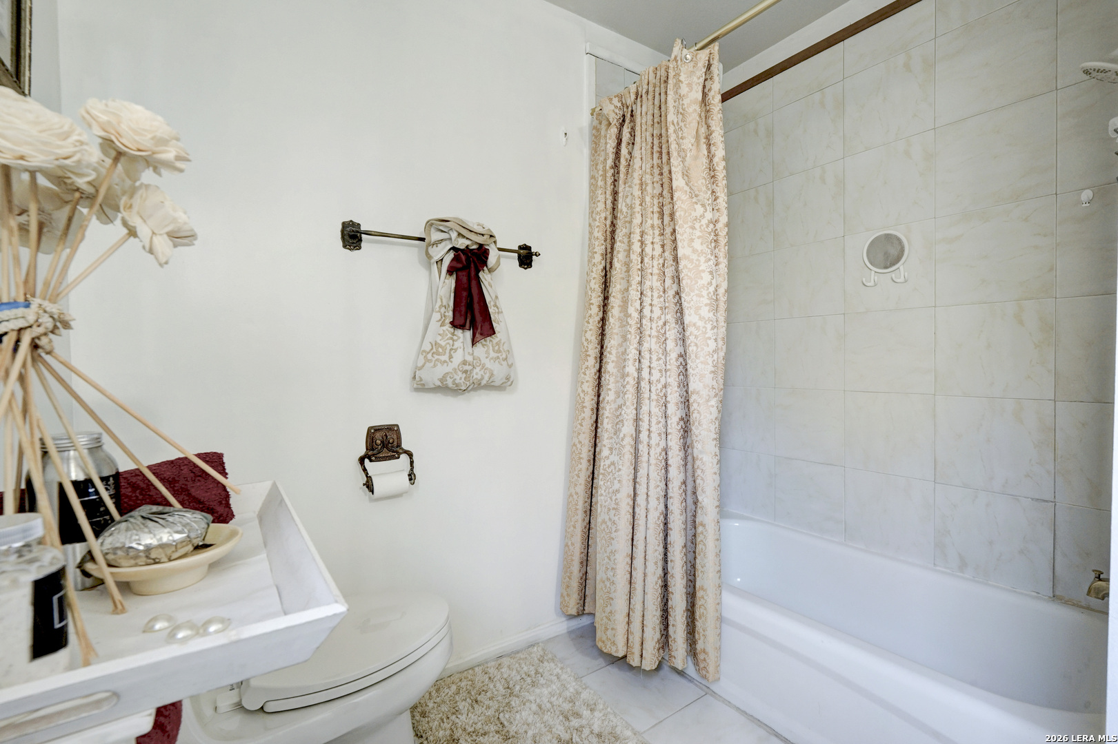 309 South Rolling Oaks Lane San Antonio, TX 78253 - Photo 26 of 43 a bathroom with a shower curtain and a sink