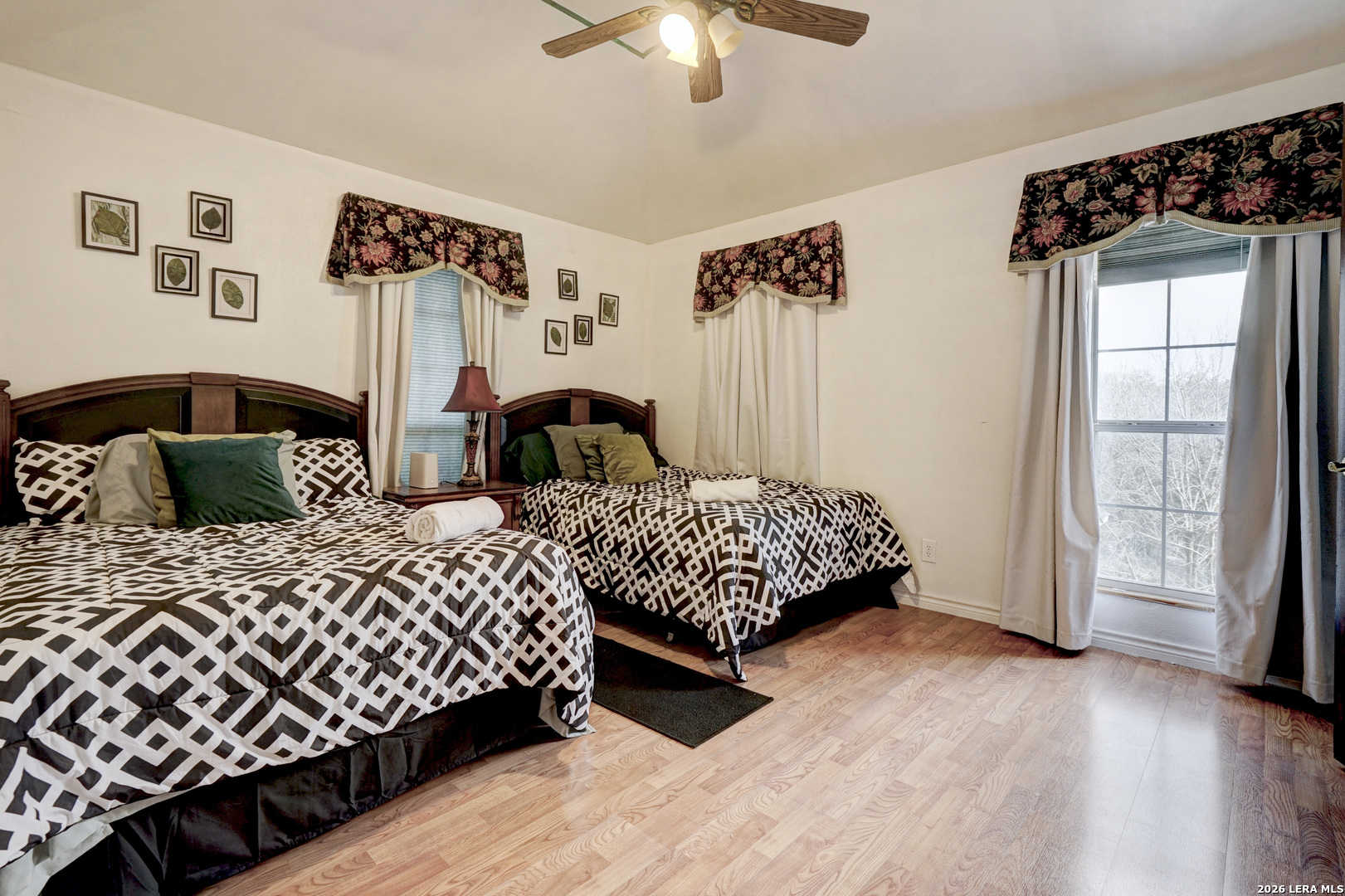 309 South Rolling Oaks Lane San Antonio, TX 78253 - Photo 31 of 43 a bedroom with two beds and a chandelier