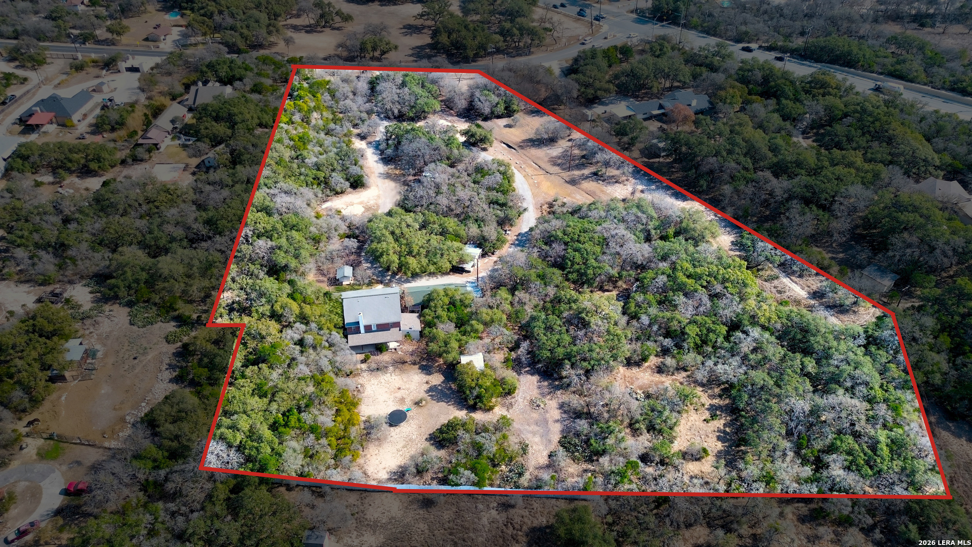 309 South Rolling Oaks Lane San Antonio, TX 78253 - Photo 40 of 43 an aerial view of a house with a yard and lots of trees all around