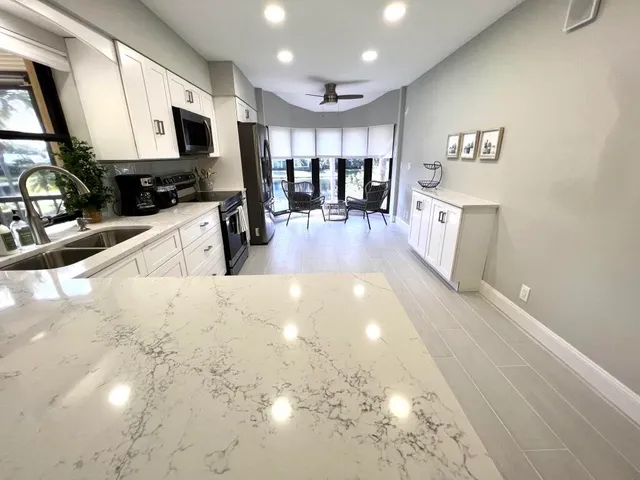 a view of a kitchen with furniture and a kitchen