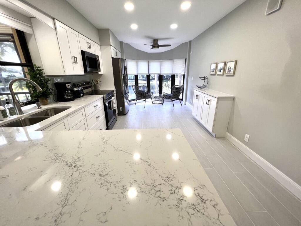 17081 Waterbend Drive, Unit 229 Jupiter, FL 33477 - Photo 1 of 26 a view of a kitchen with furniture and a kitchen