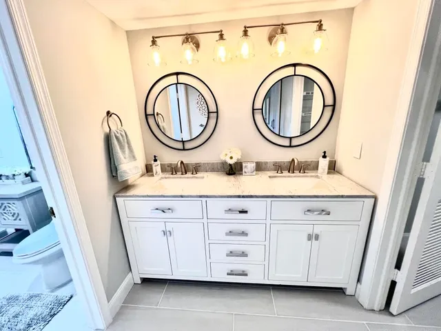 a bathroom with a sink a vanity and a mirror