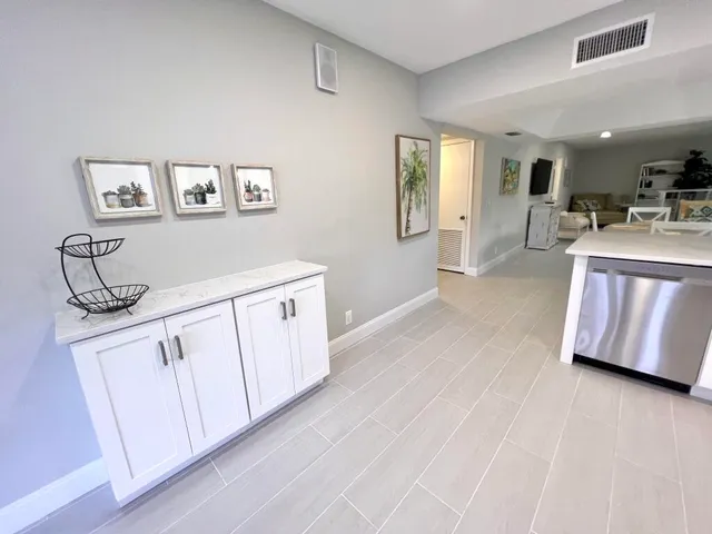 a view of a kitchen with electric appliances