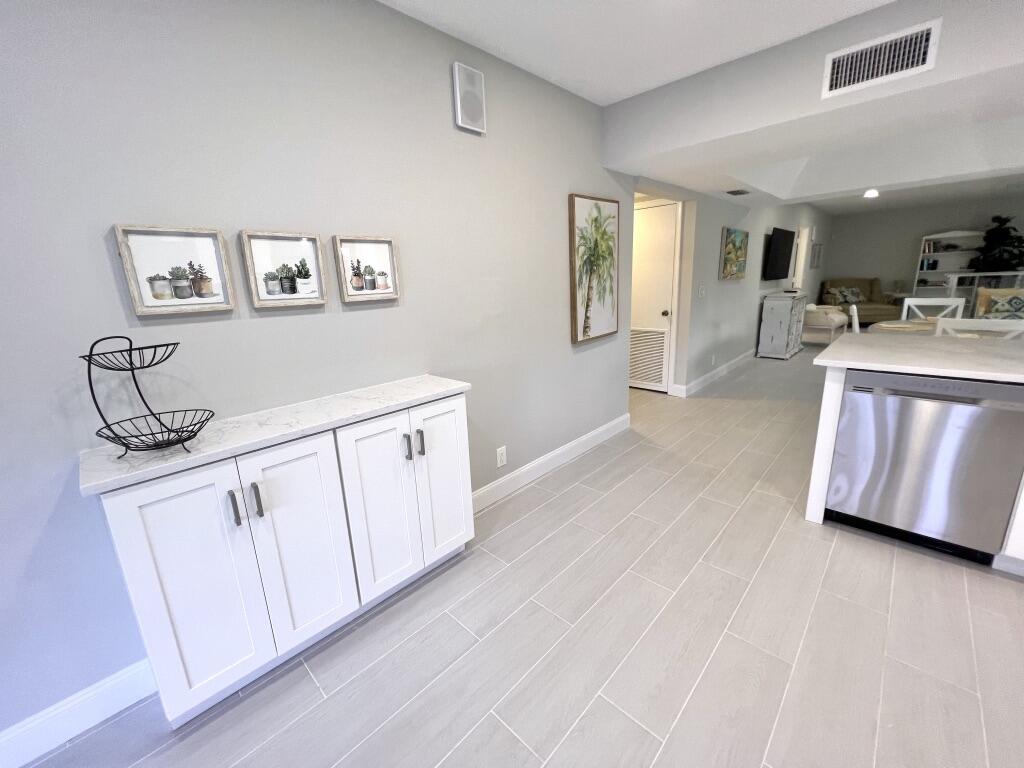 17081 Waterbend Drive, Unit 229 Jupiter, FL 33477 - Photo 16 of 26 a view of a kitchen with electric appliances