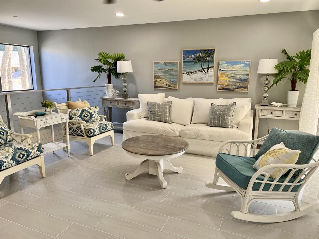 17081 Waterbend Drive, Unit 229 Jupiter, FL 33477 - Photo 17 of 26 a living room with furniture and a table