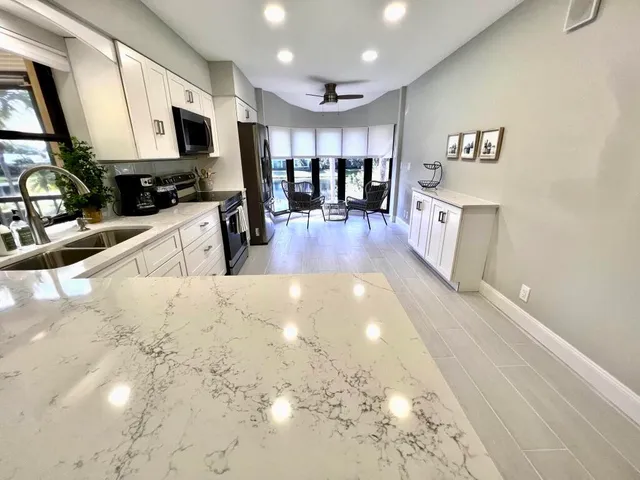 a view of a electric appliances in kitchen and dining room