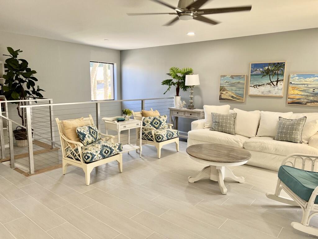 17081 Waterbend Drive, Unit 229 Jupiter, FL 33477 - Photo 2 of 26 a living room with furniture and a table