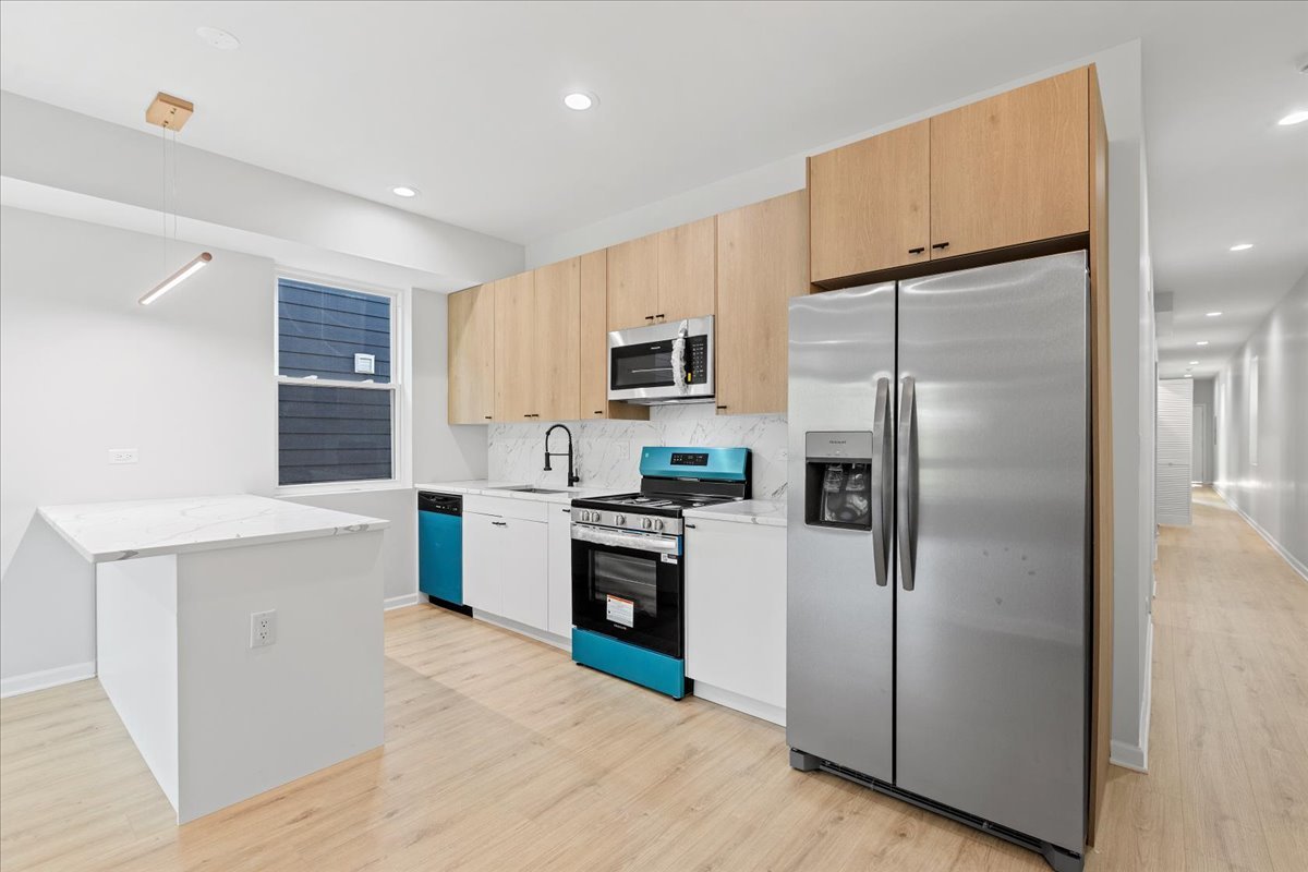 4537 South Evans Avenue, Unit 2 Chicago, IL 60653 - Photo 3 of 12 a kitchen with a refrigerator sink and microwave
