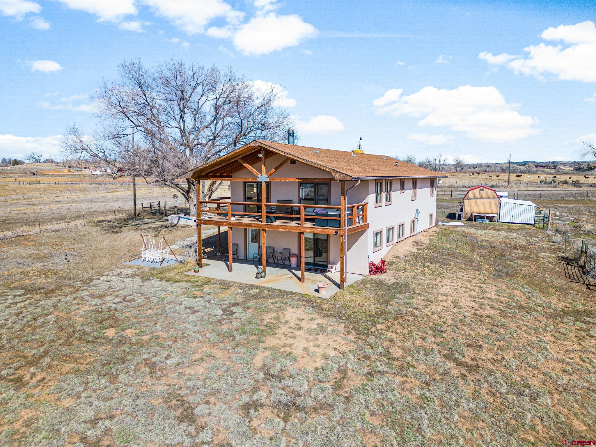 25220 County Rd M Cortez, CO 81321 - Photo 11 of 45 a view of a house with a yard covered in snow