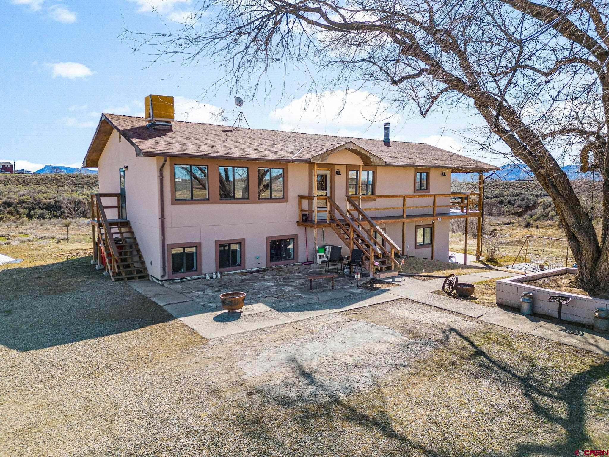 25220 County Rd M Cortez, CO 81321 - Photo 13 of 45 a front view of a house with parking area