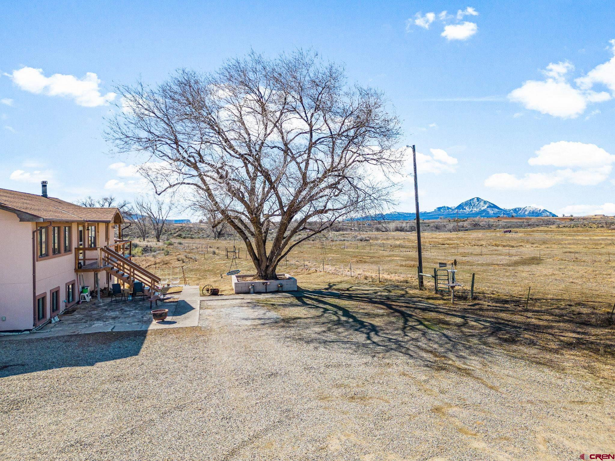 25220 County Rd M Cortez, CO 81321 - Photo 14 of 45 a view of a yard with wooden fence