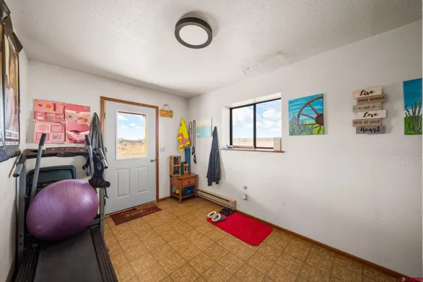 a bedroom with a bed and a couch