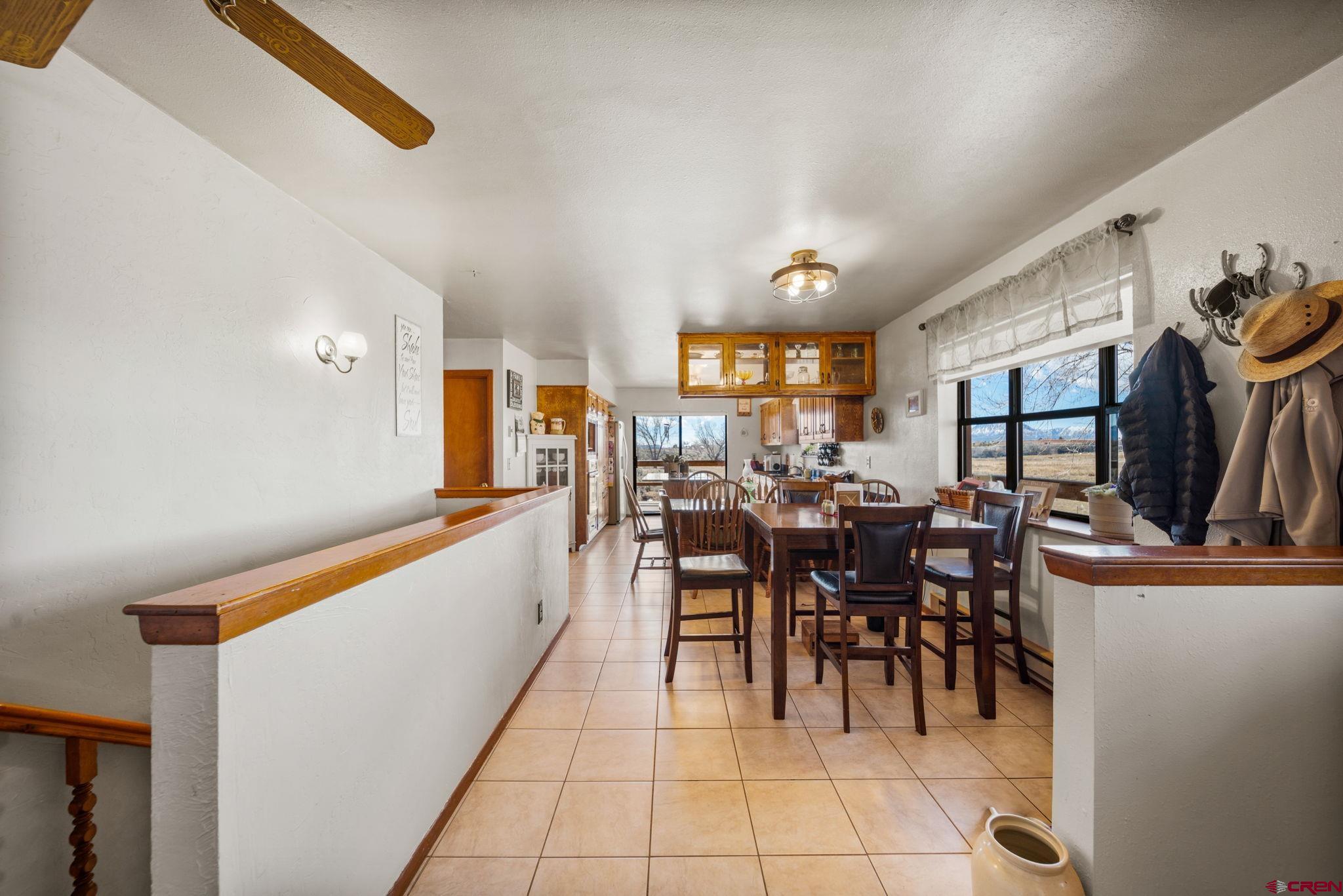 25220 County Rd M Cortez, CO 81321 - Photo 31 of 45 a view of a dining area with furniture and chandelier
