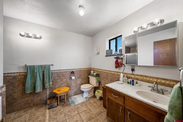 a bathroom with a sink double vanity and tub