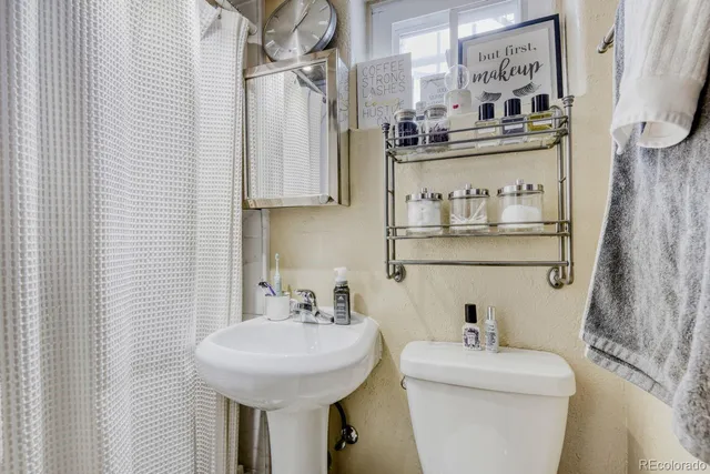 a bathroom with a sink and a toilet